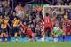 Arshavin (23) scores Arsenal's third against Liverpool in March 2009