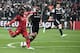 Lyon's Alexandre Lacazette (L) kicks the ball next to Besiktas' Dusko Tosic (C) during the UEFA Europa League second leg quarter final football match between Besiktas and Lyon (OL) on April 20, 2017, at the Vodafone arena stadium in Istanbul. / AFP PHOTO