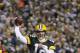 GREEN BAY, WI - DECEMBER 25: Aaron Rodgers #12 of the Green Bay Packers throws a touchdown pass to James Jones #89 during the first half against the Chicago Bears on December 25, 2011 at Lambeau Field in Green Bay, Wisconsin. (Photo by David Banks/Getty Images)