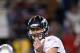 FOXBORO, MA - JANUARY 14: Tim Tebow #15 of the Denver Broncos gestures as he steps to the line of scrimmage against the New England Patriots during their AFC Divisional Playoff Game at Gillette Stadium on January 14, 2012 in Foxboro, Massachusetts. (Photo by Elsa/Getty Images)