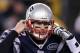 FOXBORO, MA - JANUARY 14: Tom Brady #12 of the New England Patriots gestures as he calls signals out down the line of scrimmage against the Denver Broncos during their AFC Divisional Playoff Game at Gillette Stadium on January 14, 2012 in Foxboro, Massachusetts. (Photo by Elsa/Getty Images)