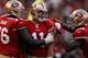 SAN FRANCISCO, CA - JANUARY 14: Alex Smith #11 of the San Francisco 49ers celebrates his touchdown with teammates in the fourth quarter against the New Orleans Saints during the NFC Divisional playoff game at Candlestick Park on January 14, 2012 in San Francisco, California. (Photo by Ezra Shaw/Getty Images)