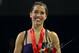 ONTARIO, CA - OCTOBER 23: Alissa Czisny stands on the awards podium after receiving her gole medal in the Ladies competition during Hilton HHonors Skate America at Citizens Business Bank Arena on October 23, 2011 in Ontario, California. (Photo by Stephen Dunn/Getty Images)