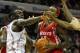 CHARLOTTE, NC - JANUARY 10: Bismack Biyombo #0 and teammate D.J. White #8 of the Charlotte Bobcats try to stop Jordan Hill #27 of the Houston Rockets on his way to the basket during their game at Time Warner Cable Arena on January 10, 2012 in Charlotte, North Carolina. NOTE TO USER: User expressly acknowledges and agrees that, by downloading and or using this photograph, User is consenting to the terms and conditions of the Getty Images License Agreement. (Photo by Streeter Lecka/Getty Images)