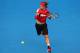 MELBOURNE, AUSTRALIA - JANUARY 20: Lukas Lacko of Slovakia plays a forehand in his third round match against Rafael Nadal of Spain during day five of the 2012 Australian Open at Melbourne Park on January 20, 2012 in Melbourne, Australia. (Photo by Cameron Spencer/Getty Images)