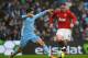 MANCHESTER, ENGLAND - JANUARY 08: Samir Nasri of Manchester City challenges Wayne Rooney of Manchester United during the FA Cup Third Round match between Manchester City and Manchester United at the Etihad Stadium on January 8, 2012 in Manchester, England. (Photo by Alex Livesey/Getty Images)