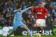 MANCHESTER, ENGLAND - JANUARY 08: Samir Nasri of Manchester City challenges Wayne Rooney of Manchester United during the FA Cup Third Round match between Manchester City and Manchester United at the Etihad Stadium on January 8, 2012 in Manchester, England. (Photo by Alex Livesey/Getty Images)