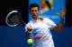 MELBOURNE, AUSTRALIA - JANUARY 21: Novak Djokovic of Serbia plays a forehand in his third round match against Nicholas Mahut of France during day six of the 2012 Australian Open at Melbourne Park on January 21, 2012 in Melbourne, Australia. (Photo by Clive Brunskill/Getty Images)