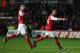 SWANSEA, WALES - JANUARY 15: Theo Walcott of Arsenal (R) celebrates his goal with Robin van Persie during the Barclays Premier League match between Swansea City and Arsenal at Liberty Stadium on January 15, 2012 in Swansea, Wales. (Photo by Michael Steele/Getty Images)