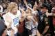 DALLAS, TX - JUNE 16: Forward Dirk Nowitzki of the Dallas Mavericks high fives fans during the Dallas Mavericks Victory celebration on June 16, 2011 in Dallas, Texas. (Photo by Brandon Wade/Getty Images)