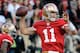 SAN FRANCISCO, CA - JANUARY 14: Alex Smith #11 of the San Francisco 49ers looks to pass from the pocket during the NFC Divisional playoff game against the New Orleans Saints at Candlestick Park on January 14, 2012 in San Francisco, California. (Photo by Thearon W. Henderson/Getty Images)