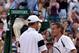 WIMBLEDON, ENGLAND - JULY 01: Lleyton Hewitt of Australia (R) shakes hands with Andy Roddick of USA after the men's singles quarter final match Championships at the All England Lawn Tennis and Croquet Club on July 1, 2009 in London, England. (Photo by Hamish Blair/Getty Images)