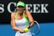 MELBOURNE, AUSTRALIA - JANUARY 21: (EDITORS NOTE: Retransmission of Image 137445680.jpg with alternate crop) Maria Sharapova of Russia plays a backhand in her third round match against Angelique Kerber of Germany during day six of the 2012 Australian Open at Melbourne Park on January 21, 2012 in Melbourne, Australia. (Photo by Lucas Dawson/Getty Images)