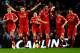 MANCHESTER, ENGLAND - JANUARY 11: Steven Gerrard of Liverpool celebrates scoring the opening goal from a penalty kick with his team mates during the Carling Cup Semi Final First Leg match between Manchester City and Liverpool at the Etihad Stadium on January 11, 2012 in Manchester, England. (Photo by Laurence Griffiths/Getty Images)