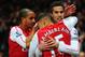 LONDON, ENGLAND - JANUARY 22: Robin van Persie of Arsenal (R) celebrates with Theo Walcott (L)and Alex Oxlade-Chamberlain (C) as he scores their first goal during the Barclays Premier League match between Arsenal and Manchester United at Emirates Stadium on January 22, 2012 in London, England. (Photo by Mike Hewitt/Getty Images)
