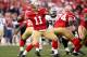 SAN FRANCISCO, CA - JANUARY 14: Alex Smith #11 of the San Francisco 49ers looks to pass from the pocket in the fourth quarter of the NFC Divisional playoff game against the New Orleans Saints at Candlestick Park on January 14, 2012 in San Francisco, California. (Photo by Ezra Shaw/Getty Images)