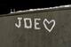 STATE COLLEGE, PA - JANUARY 22: A sign made of snow adorns a wall near the statue of Joe Paterno, the former Penn State football coach, outside of Beaver Stadium in the early hours of January 22, 2012 in State College, Pennsylvania. The community was reacting to news that Joe Paterno, who is suffering from lung cancer and who was fired in November in the aftermath of child sex abuse charges against a former assistant, was in serious condition. (Photo by Patrick Smith/Getty Images)