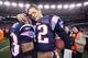 FOXBORO, MA - JANUARY 22: Tom Brady #12 of the New England Patriots celebrates with teammate Kevin Faulk #33 after defeating the Baltimore Ravens in the AFC Championship Game at Gillette Stadium on January 22, 2012 in Foxboro, Massachusetts. The New England Patriots defeated the Baltimore Ravens 20-23. (Photo by Elsa/Getty Images)