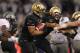 Polk running the ball against the Oregon Ducks