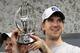 SAN FRANCISCO, CA - JANUARY 22: Eli Manning #10 of the New York Giants celebrates in the locker room with the George Halas Trophy NFC Championship trophy after the GIants won 20-17 in overtime against the San Francisco 49ers during the NFC Championship Game at Candlestick Park on January 22, 2012 in San Francisco, California. (Photo by Ezra Shaw/Getty Images)