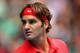 MELBOURNE, AUSTRALIA - JANUARY 20: Roger Federer of Switzerland looks on in his third round match against Ivo Karlovic of Croatia during day five of the 2012 Australian Open at Melbourne Park on January 20, 2012 in Melbourne, Australia. (Photo by Cameron Spencer/Getty Images)
