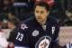 WINNIPEG, CANADA - DECEMBER 22: Dustin Byfuglien #33 of the Winnipeg Jets warms up on the ice before a game against the Montreal Canadiens in NHL action at the MTS Centre on December 22, 2011 in Winnipeg, Manitoba, Canada. (Photo by Marianne Helm/Getty Images)