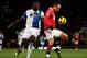 MANCHESTER, ENGLAND - NOVEMBER 27: Dimitar Berbatov of Manchester United competes with Chris Samba of Blackburn Rovers during the Barclays Premier League match between Manchester United and Blackburn Rovers at Old Trafford on November 27, 2010 in Manchester, England. (Photo by Alex Livesey/Getty Images)