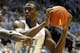 CHAPEL HILL, NC - DECEMBER 21: J'Covan Brown #14 of the Texas Longhorns tries to stop Harrison Barnes #40 of the North Carolina Tar Heels during their game at Dean Smith Center on December 21, 2011 in Chapel Hill, North Carolina. (Photo by Streeter Lecka/Getty Images)