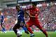 LIVERPOOL, ENGLAND - OCTOBER 15: Luis Suarez of Liverpool tussles for posesssion with Patrice Evra of Manchester United during the Barclays Premier League match between Liverpool and Manchester United at Anfield on October 15, 2011 in Liverpool, England. (Photo by Clive Brunskill/Getty Images)