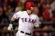 ARLINGTON, TX - OCTOBER 24: Mitch Moreland #18 of the Texas Rangers watches the ball after hitting a solo home run in the third inning during Game Five of the MLB World Series against the St. Louis Cardinals at Rangers Ballpark in Arlington on October 24, 2011 in Arlington, Texas. (Photo by Rob Carr/Getty Images)