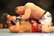LAS VEGAS - JULY 11: Brock Lesnar holds down Frank Mir during their heavyweight title bout during UFC 100 on July 11, 2009 in Las Vegas, Nevada. (Photo by Jon Kopaloff/Getty Images)