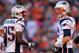 DENVER, CO - DECEMBER 18: Wide receiver Chad Ochocinco #85 talks with quarterback Tom Brady #12 of the New England Patriots during a game against the Denver Broncos at Sports Authority Field at Mile High on December 18, 2011 in Denver, Colorado. (Photo by Doug Pensinger/Getty Images)