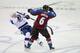 DENVER, CO - DECEMBER 23: Erik Johnson #6 of the Colorado Avalanche delivers a hit to Dana Tyrell #42 of the Tampa Bay Lightning at the Pepsi Center on December 23, 2011 in Denver, Colorado. (Photo by Doug Pensinger/Getty Images)
