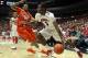 TUCSON, AZ - DECEMBER 10: Kevin Parrom #3 of the Arizona Wildcats handles the ball under pressure from K.J. McDaniels #32 of the Clemson Tigers during the first half of the college basketball game at McKale Center on December 10, 2011 in Tucson, Arizona. The Wildcats defeated the Tigers 63-47. (Photo by Christian Petersen/Getty Images)