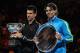 MELBOURNE, AUSTRALIA - JANUARY 29: Novak Djokovic of Serbia (L) poses with the Norman Brookes Challenge Cup alongside Raphael Nadal of Spain with the runners-up trophy after winning the men's final match against Rafael Nadal of Spain during day fourteen of the 2012 Australian Open at Melbourne Park on January 29, 2012 in Melbourne, Australia. (Photo by Quinn Rooney/Getty Images)