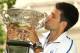 MELBOURNE, AUSTRALIA - JANUARY 30: Novak Djokovic of Serbia poses with the Norman Brookes Challenge Cup after winning the 2012 men's Australian Open, at Carlton Gardens on January 30, 2012 in Melbourne, Australia. (Photo by Lucas Dawson/Getty Images)