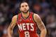 PHOENIX, AZ - JANUARY 13: Deron Williams #8 of the New Jersey Nets in action during the NBA game against the Phoenix Suns at US Airways Center on January 13, 2012 in Phoenix, Arizona. The Nets defeated the Suns 110-103. NOTE TO USER: User expressly acknowledges and agrees that, by downloading and or using this photograph, User is consenting to the terms and conditions of the Getty Images License Agreement. (Photo by Christian Petersen/Getty Images)
