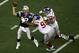 GLENDALE, AZ - FEBRUARY 03: Quarterback Tom Brady #12 of the New England Patriots is hit as he throws by defensive tackle Barry Cofield #96 and Osi Umenyiora #72 of the New York Giants in the first half during Super Bowl XLII on February 3, 2008 at the University of Phoenix Stadium in Glendale, Arizona. (Photo by Jim McIsaac/Getty Images)