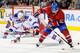 MONTREAL, CANADA - JANUARY 15: David Desharnais #51 of the Montreal Canadiens stick handles the puck in front of Stu Bickel #41 of the New York Rangers during the NHL game at the Bell Centre on January 15, 2012 in Montreal, Quebec, Canada. (Photo by Richard Wolowicz/Getty Images)