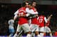 LONDON, ENGLAND - JANUARY 29: Theo Walcott of Arsenal (14) celebrates with team mates as he scores their second gaol during the FA Cup with Budweiser Fourth Round match between Arsenal and Aston Villa at Emirates Stadium on January 29, 2012 in London, England. (Photo by Paul Gilham/Getty Images)
