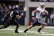 ARLINGTON, TX - OCTOBER 28: Riley Nelson #13 of the BYU Cougars runs against Jason Verrett #2 of the TCU Horned Frogs at Cowboys Stadium on October 28, 2011 in Arlington, Texas. The TCU Horned Frogs defeated the BYU Cougars 38-28. (Photo by Sarah Glenn/Getty Images)