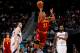 ATLANTA, GA - JANUARY 21: Alonzo Gee #33 of the Cleveland Cavaliers attemps a halfcourt shot as time expires in the first half between Vladimir Radmanovic #77 and Ivan Johnson #44 of the Atlanta Hawks at Philips Arena on January 21, 2012 in Atlanta, Georgia. NOTE TO USER: User expressly acknowledges and agrees that, by downloading and or using this photograph, User is consenting to the terms and conditions of the Getty Images License Agreement. (Photo by Kevin C. Cox/Getty Images)