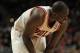 CHICAGO, IL - JANUARY 21: Loul Deng #9 of the Chicago Bulls holds his wrist after injuring it shooting a shot against the Charlotte Bobcats at the United Center on January 21, 2012 in Chicago, Illinois. The Bulls defeated the Bobcats 95-89. NOTE TO USER: User expressly acknowledges and agrees that, by downloading and or using this photograph, User is consenting to the terms and conditions of the Getty Images License Agreement. (Photo by Jonathan Daniel/Getty Images)