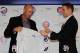 CHICAGO, IL - NOVEMBER 18: President Theo Epstein of the Chicago Cubs helps new manager Dale Sveum with his jersey during a press conference at Wrigley Field on November 18, 2011 in Chicago, Illinois. (Photo by Jonathan Daniel/Getty Images)