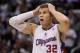 LOS ANGELES, CA - JANUARY 11: Blake Griffin #32 of the Los Angeles Clippers reacts after committing a foul in the fourth quarter against the Miami Heat at Staples Center on January 11, 2012 in Los Angeles, California. The Clippers defeated the Heat 95-89 in overtime. (Photo by Jeff Gross/Getty Images)