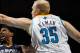 NEW ORLEANS, LA - JANUARY 18: O.J. Mayo #32 of the Memphis Grizzlies shoots the ball around Chris Kaman #35 of the New Orleans Hornets at New Orleans Arena on January 18, 2012 in New Orleans, Louisiana. NOTE TO USER: User expressly acknowledges and agrees that, by downloading and or using this photograph, User is consenting to the terms and conditions of the Getty Images License Agreement. (Photo by Chris Graythen/Getty Images)