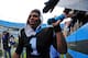 CHARLOTTE, NC - DECEMBER 24: Cam Newton #1 of the Carolina Panthers celebrates with fans after the game against the Tampa Bay Buccaneers at Bank of America Stadium on December 24, 2011 in Charlotte, North Carolina (Photo by Scott Cunningham/Getty Images)