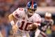 INDIANAPOLIS, IN - FEBRUARY 05: Quarterback Eli Manning #10 of the New York Giants hands the ball off during the game against the New England Patriots during Super Bowl XLVI at Lucas Oil Stadium on February 5, 2012 in Indianapolis, Indiana. (Photo by Jamie Squire/Getty Images)