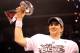 INDIANAPOLIS, IN - FEBRUARY 05: Quarterback Eli Manning #10 of the New York Giants poses with the Vince Lombardi Trophy after the Giants defeated the Patriots by a score of 21-17 in Super Bowl XLVI at Lucas Oil Stadium on February 5, 2012 in Indianapolis, Indiana. (Photo by Ezra Shaw/Getty Images)