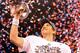 INDIANAPOLIS, IN - FEBRUARY 05: Quarterback Eli Manning #10 of the New York Giants poses with the Vince Lombardi Trophy after the Giants defeated the Patriots by a score of 21-17 in Super Bowl XLVI at Lucas Oil Stadium on February 5, 2012 in Indianapolis, Indiana. (Photo by Ezra Shaw/Getty Images)